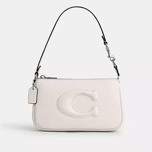 White shoulder bag with a prominent letter 'C' stitched on the front and a detachable metal chain strap.