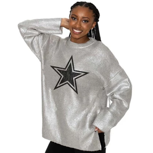 A silver pullover sweater featuring a large black star outlined in white at the center. The sweater has a loose fit with long sleeves, offering a casual and stylish look.