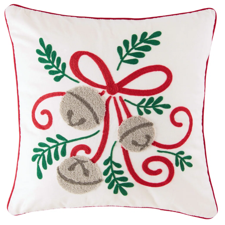Square cushion with a festive design featuring a red bow, green leaves, and gray bells on a white background, accented with red piping.
