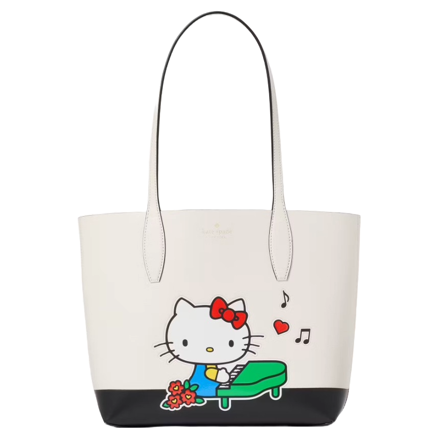 A tote bag featuring a cartoon cat character playing a piano, with musical notes and flowers. The bag is primarily white with black at the base and has two handles.