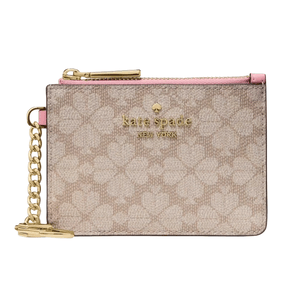 A Kate Spade New York pouch with a pink zipper, gold hardware, and a chain. The design features a floral pattern on a beige background.