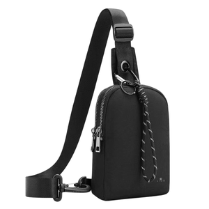 A black crossbody sling bag with an adjustable strap, featuring a zippered main compartment and a corded zipper pull.
