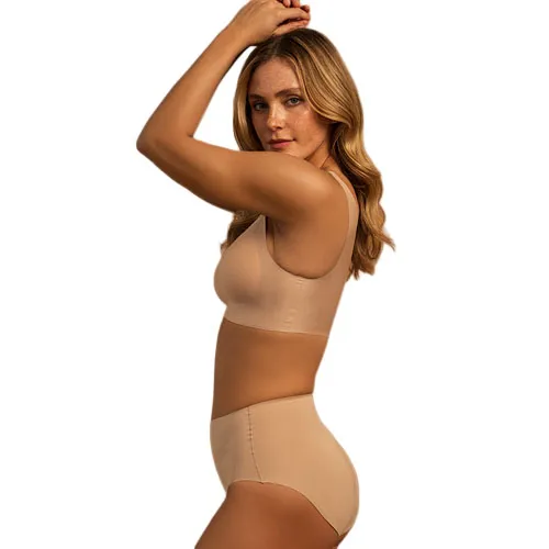 A woman is wearing a beige seamless bra and high-waisted underwear set, showcasing a smooth and comfortable fit.