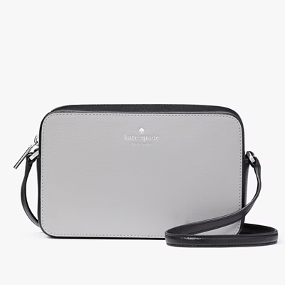 Gray Kate Spade crossbody bag with adjustable strap.