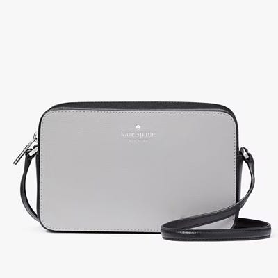 Gray Kate Spade crossbody bag with adjustable strap.