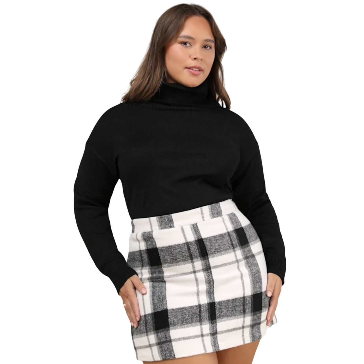 A woman is wearing a black turtleneck sweater paired with a high-waisted black and white plaid skirt.