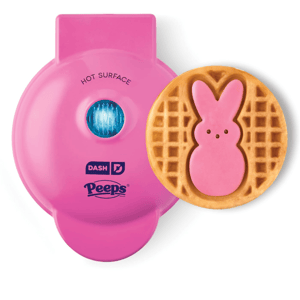 Pink Dash mini waffle maker with a Peeps design imprint, creating waffles resembling the iconic candy shape.