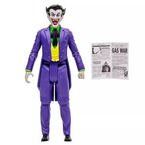 A figure of the Joker in a purple suit with a green shirt and tie, accompanied by a miniature newspaper prop.