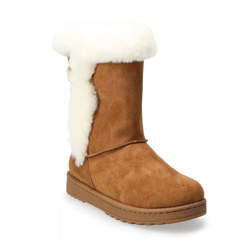 Abigail Women's Faux-Fur Winter Boots feature a mid-calf design with tan faux suede and white faux-fur trim and lining. The boots have a flat sole for comfortable wear.