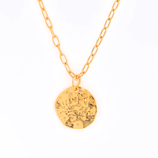 Gold-toned necklace with a textured, round pendant and a chain featuring oval links.