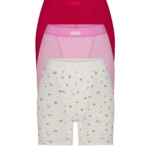 3-pack Skims Cotton Rib Boxers in red, pink, and white with a floral pattern.