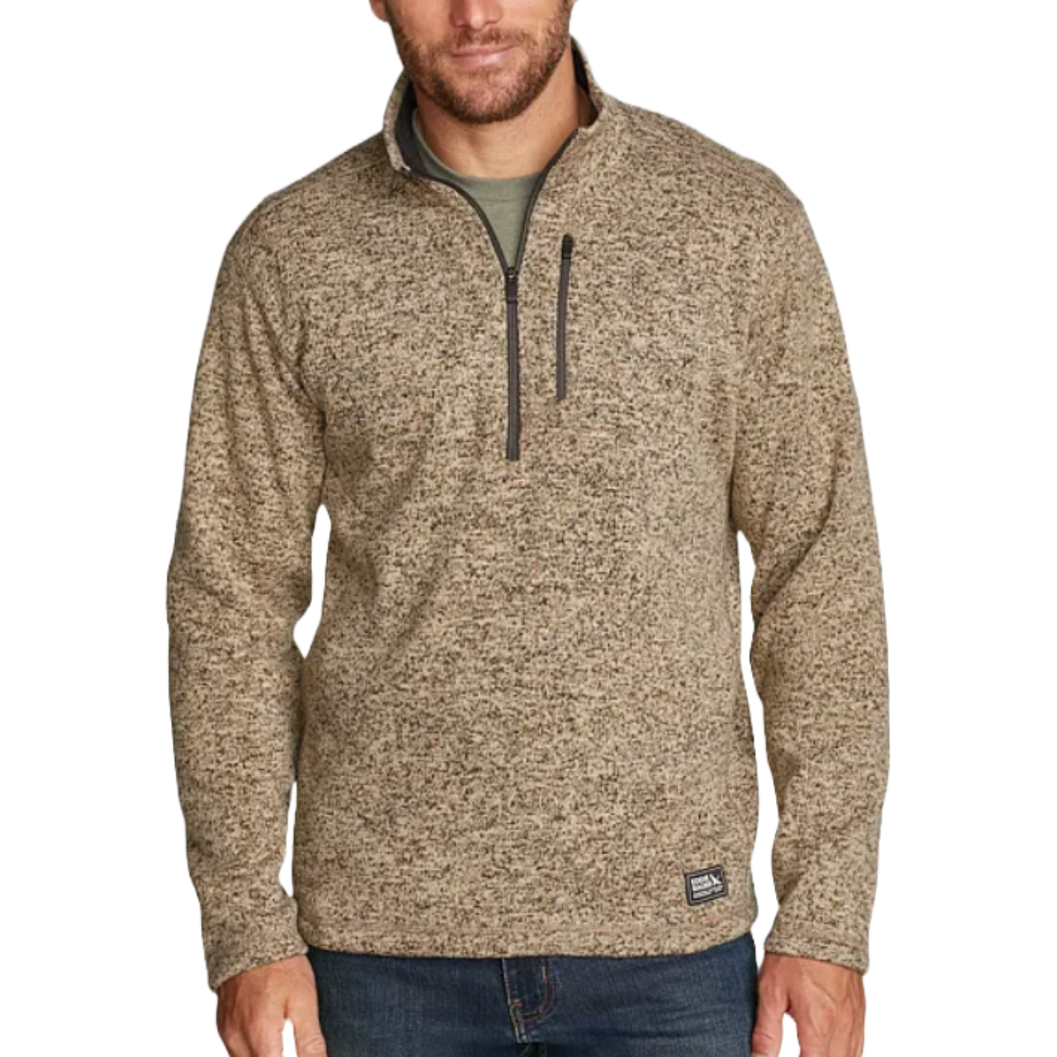 A man is wearing a beige heathered quarter-zip pullover with a chest pocket, paired with blue jeans.