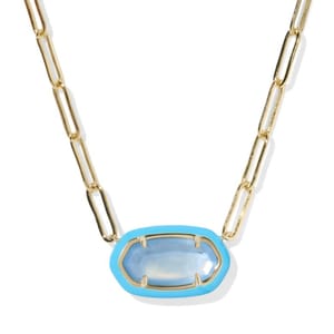 Gold chain necklace with a vibrant blue faceted stone set in a light blue bezel.