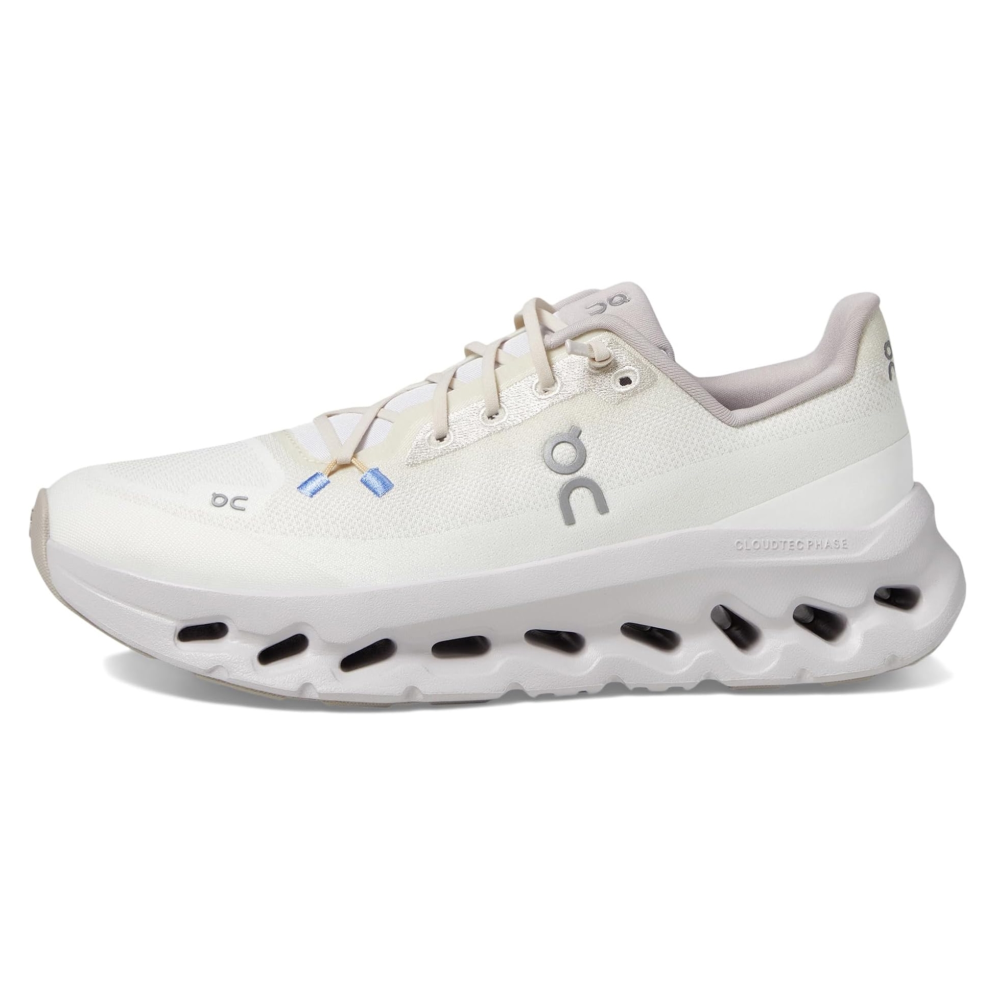 On Cloudtilt shoes are white with a sleek design, featuring unique CloudTec technology in the sole for cushioning. They have subtle branding and a mesh upper for breathability.