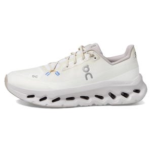 On Cloudtilt shoes are white with a sleek design, featuring unique CloudTec technology in the sole for cushioning. They have subtle branding and a mesh upper for breathability.