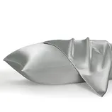 Two satin pillowcases in a silver color with a smooth, shiny finish, displayed partially unfolded.