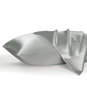 Two satin pillowcases in a silver color with a smooth, shiny finish, displayed partially unfolded.