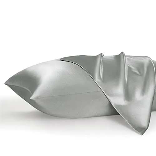 Two satin pillowcases in a silver color with a smooth, shiny finish, displayed partially unfolded.