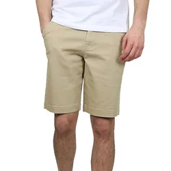 A person is wearing beige knee-length shorts and a white T-shirt, showcasing casual summer attire.
