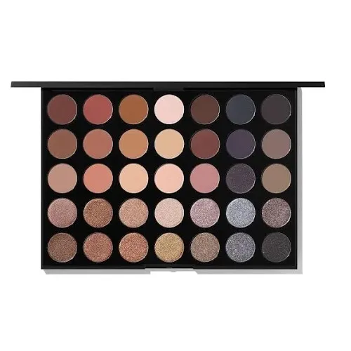 A palette of eyeshadows in various matte and shimmer shades, ranging from light neutrals to dark tones.