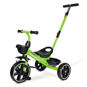 Green tricycle for kids with a push handle and a small front basket.