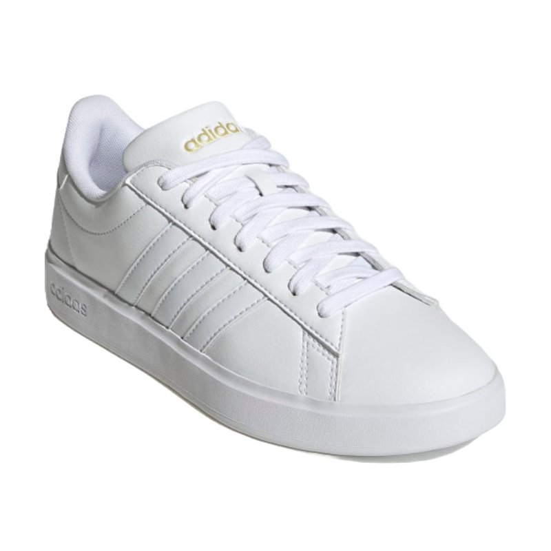 Adidas white low-top sneaker with gold logo, featuring a lace-up design and classic three-stripe detail on the side.