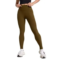 A person is wearing high-waisted brown leggings paired with white sneakers, showcasing an athletic and casual outfit.