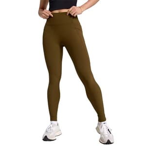 A person is wearing high-waisted brown leggings paired with white sneakers, showcasing an athletic and casual outfit.