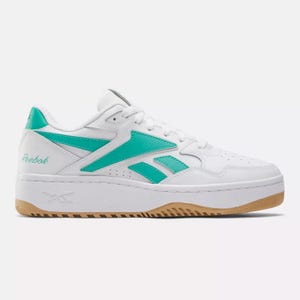 White and teal Reebok sneakers with a classic design and gum outsole.