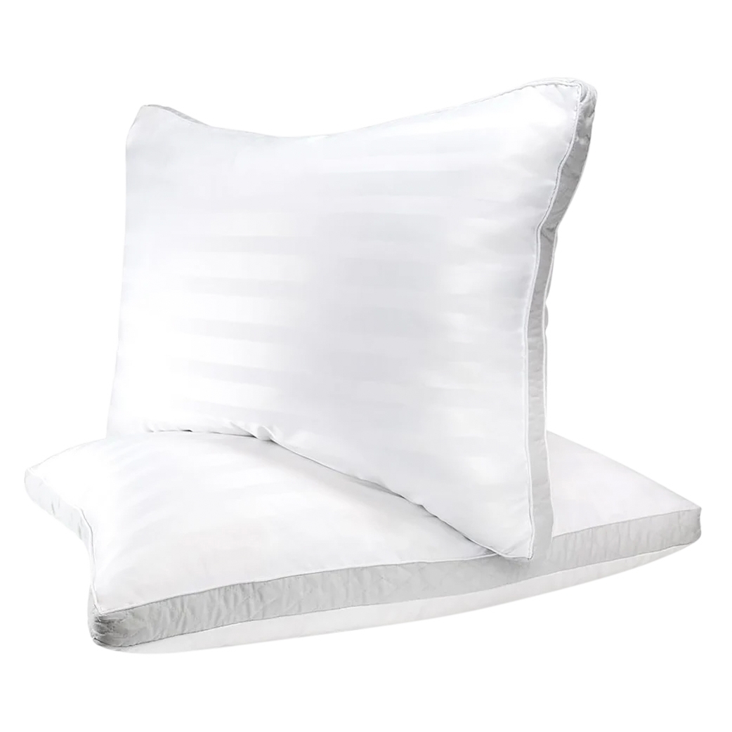 2pk Sleep Restoration Cooling Pillows are fluffy, white pillows with a subtle striped pattern, designed to offer cooling comfort while sleeping.