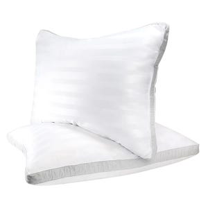 2pk Sleep Restoration Cooling Pillows are fluffy, white pillows with a subtle striped pattern, designed to offer cooling comfort while sleeping.
