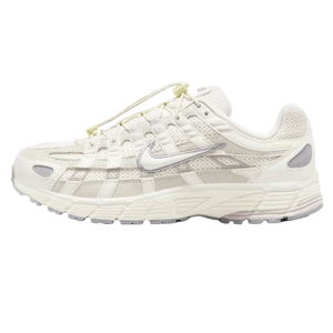 Nike Women's P-6000 Shoes in light cream have a mesh upper with synthetic overlays, featuring a laced closure and cushioned sole for comfort and style, with a distinctive swoosh logo on the side.
