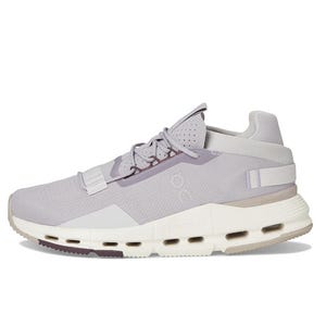 A light purple athletic shoe featuring a modern design with a cushioned sole, breathable mesh upper, and lacing system.