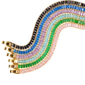 Gold bracelets featuring rows of colorful baguette-cut gemstones in black, blue, purple, teal, green, and pink.
