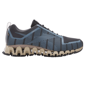The Reebok ZigWild Trail 6 Shoes feature a black and blue upper with stripe patterns and a distinctive tan zigzag sole designed for trail running.