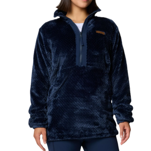 A person is wearing a navy blue, fleece half-zip pullover sweater with a high collar and long sleeves.