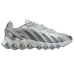 Nike sneaker featuring a futuristic design with silver tones, transparent bubble cushioning, and a wavy pattern on the upper section.