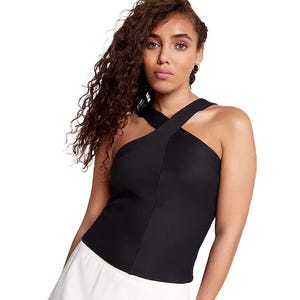 Calia Built-In Bra Halter Tank features a crisscross halter neckline in black with a fitted silhouette and built-in bra, paired with a white bottom.