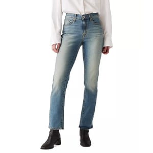 Levi's Straight Leg Jeans feature a classic design with a medium blue wash, subtle fading on the front, and a high-rise fit. They have five pockets and are paired with black ankle boots and a white shirt.