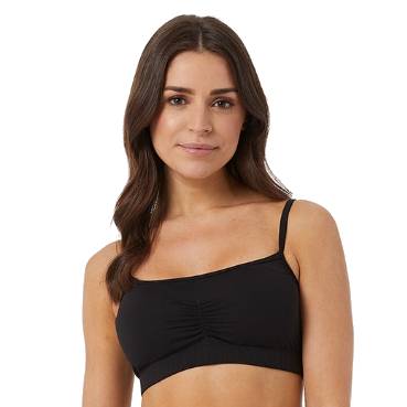 A woman wearing a black bralette with a ruched center detail.