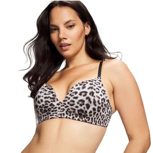 A woman is wearing a leopard print, wire-free bra with black straps.
