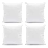 Set of four plain white square pillows.