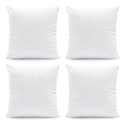 Set of four plain white square pillows.