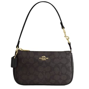 The Coach Outlet Nolita 19 Bag features a dark signature canvas with a gold-tone logo, a detachable leather strap, and a zip-top closure, accented with gold hardware.