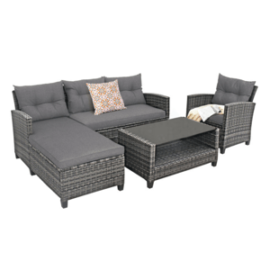4-piece grey patio furniture set with wicker frame includes a sectional sofa with chaise, an armchair, a glass-top coffee table, and decorative cushions.