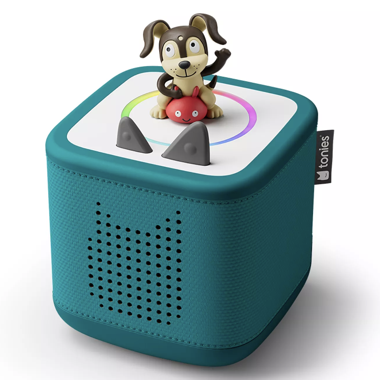 A teal Toniebox audio player with a dog figurine on top, designed for children to play stories and songs interactively.