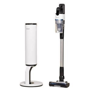 A Levoit cordless stick vacuum is shown next to its sleek, cylindrical charging and storage base.