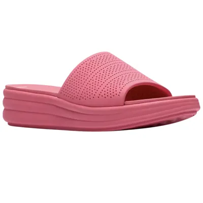 Pink slide sandal with a perforated upper and cushioned sole.
