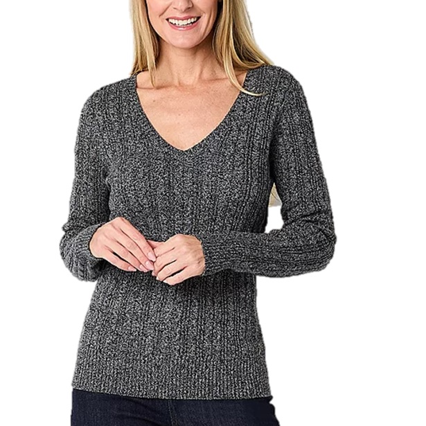 A woman is wearing a gray cable-knit V-neck sweater with long sleeves and a fitted design.