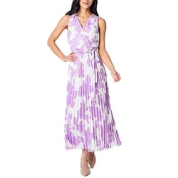 Sleeveless floral maxi dress with a purple and white pattern, featuring a V-neck, wrap-style top, belted waist, and pleated skirt. Paired with neutral-colored pointed-toe shoes.